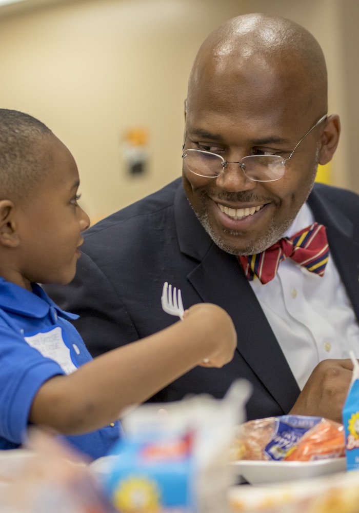 A photo of Dr. Rodney Watson, Spring ISD superintendent, is in The Holdsworth Center’s 2-year District Leadership Program, with a student in class.