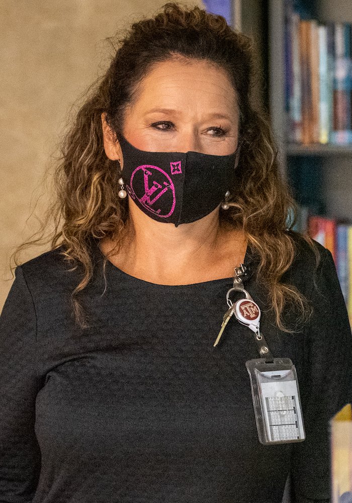 Anitra Crisp, Principal at McNair Middle School in Southwest ISD is photographed wearing a face mask on campus with students.