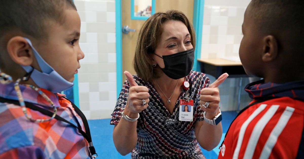 Dr. Jeanette Ball, superintendent of Judson ISD, is photographed giving a thumbs up to students at Rolling Meadows Elementary on the first day of school on August 16, 2021.