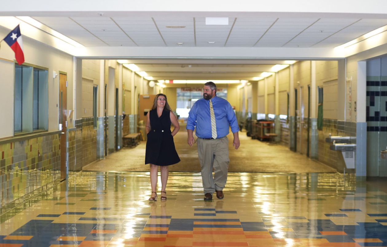 Former Assistant Principal Amy Garza and Principal Brian Pennartz walk the hallways of Bob Hope Elementary School.