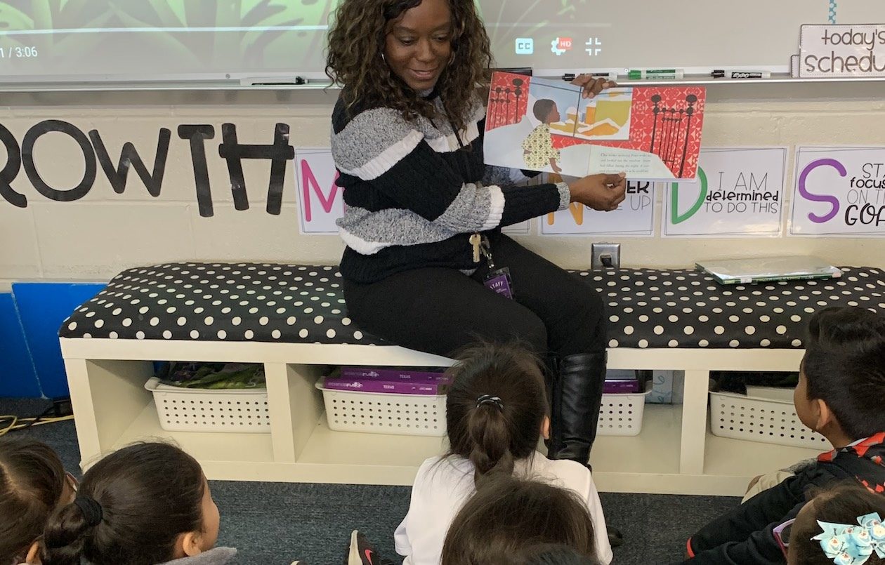 Katherine Young, Instructional Coach, Crow Leadership Academy, Arlington ISD reads to students in the classroom.