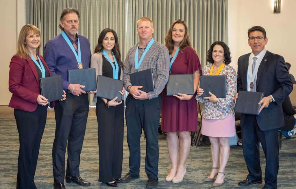 Ryan Smith (center) and Mandy Estes (second from right) graduated from Holdsworth’s two-year District Leadership Program in 2019 along with a team of other central office leaders, including Superintendent Steve Flores (far right) is pictured in their Holdsworth session.