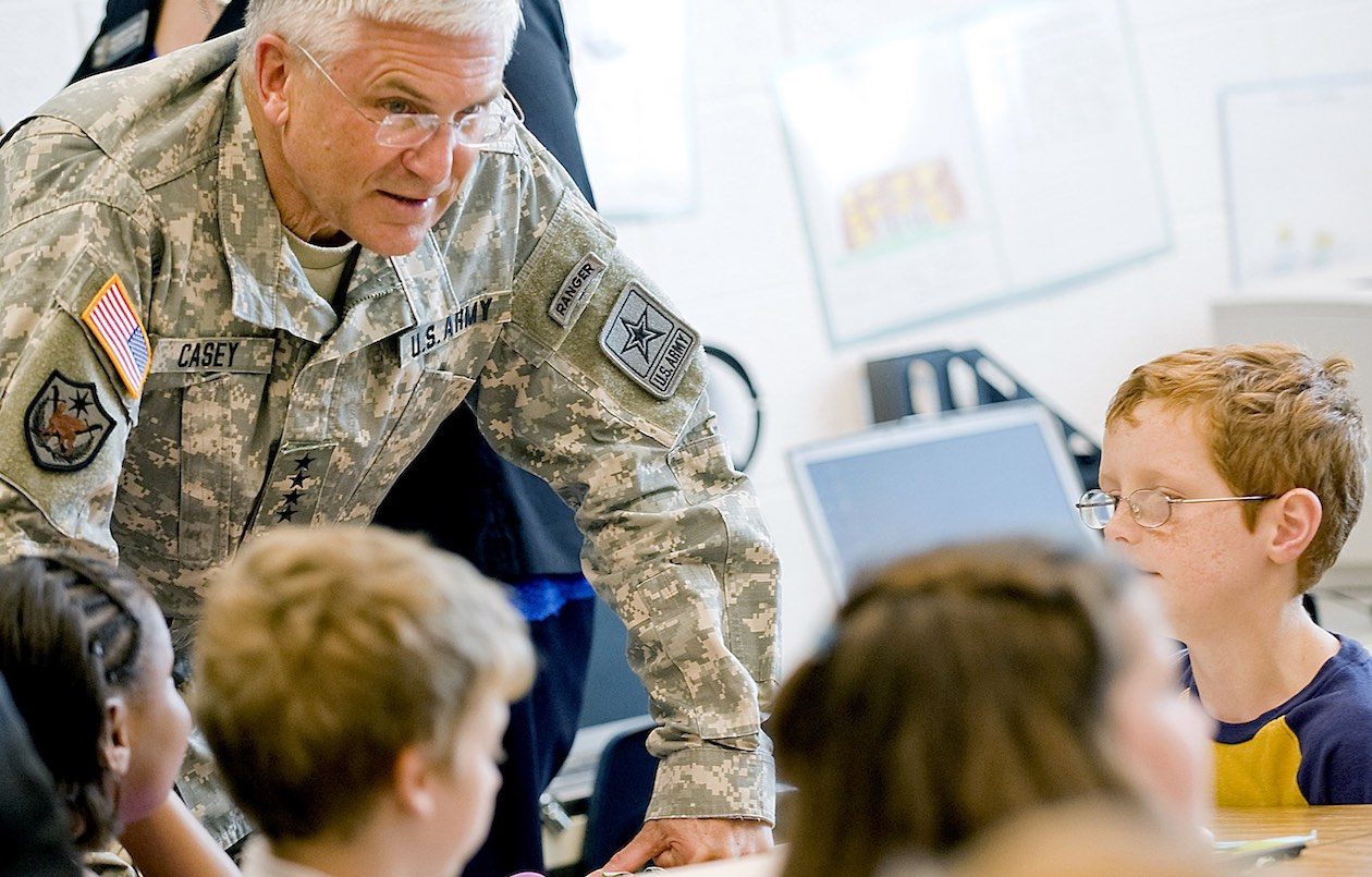 Army Chief of Staff General George W. Casey Jr. speaks with children at the Fort Belvoir Elementary School Va. on June 22 2010. Photo courtesy of the US Department of Defense.