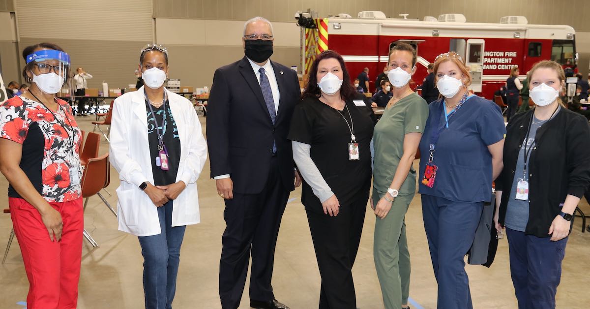 Dr. Marcelo Cavazos, Superintendent, Arlington ISD, is photographed with AISD nurses at a district COVID-19 vaccination site.
