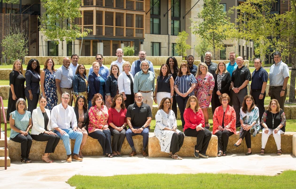 New members of the Holdsworth Partnership Cohort 3 are photographed together on the Campus at Lake Austin in 2021.