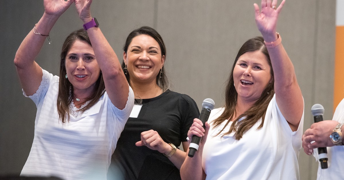 Lydia Trevino, Sintia Lopez and Delia Ortiz are photographed speaking at a learning session for The Holdsworth Center’s Campus Leadership Program.