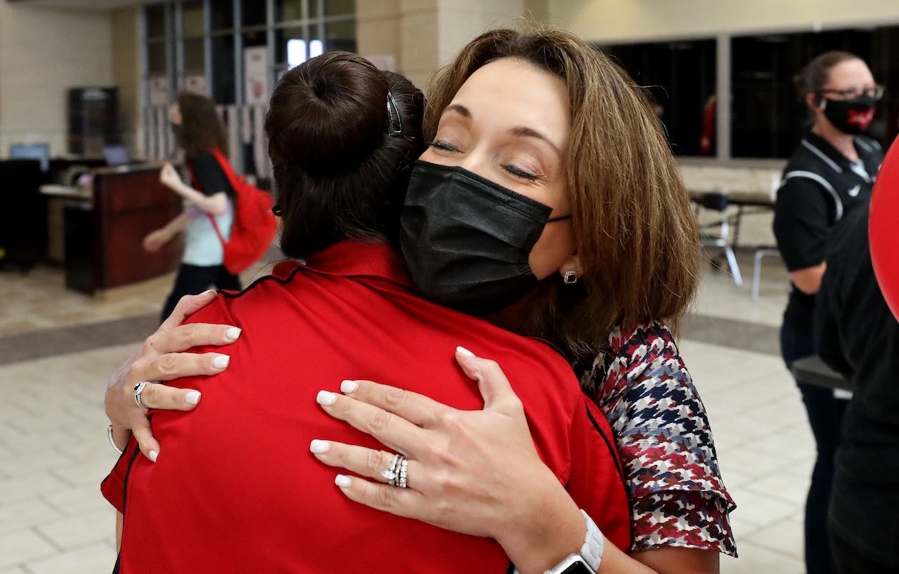 Dr. Jeanette Ball, superintendent of Judson ISD, is pictured hugging someone at Rolling Meadows Elementary on the first day of school on August 16, 2021.