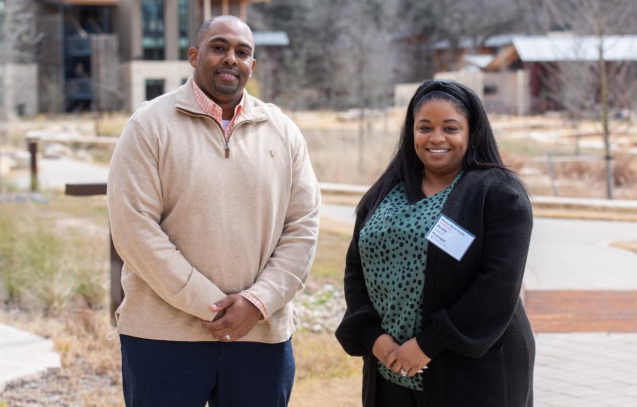 Charles Land and Aisley Adams of Aldine ISD are photographed on the Campus at Lake Austin during a Holdsworth Center program session.