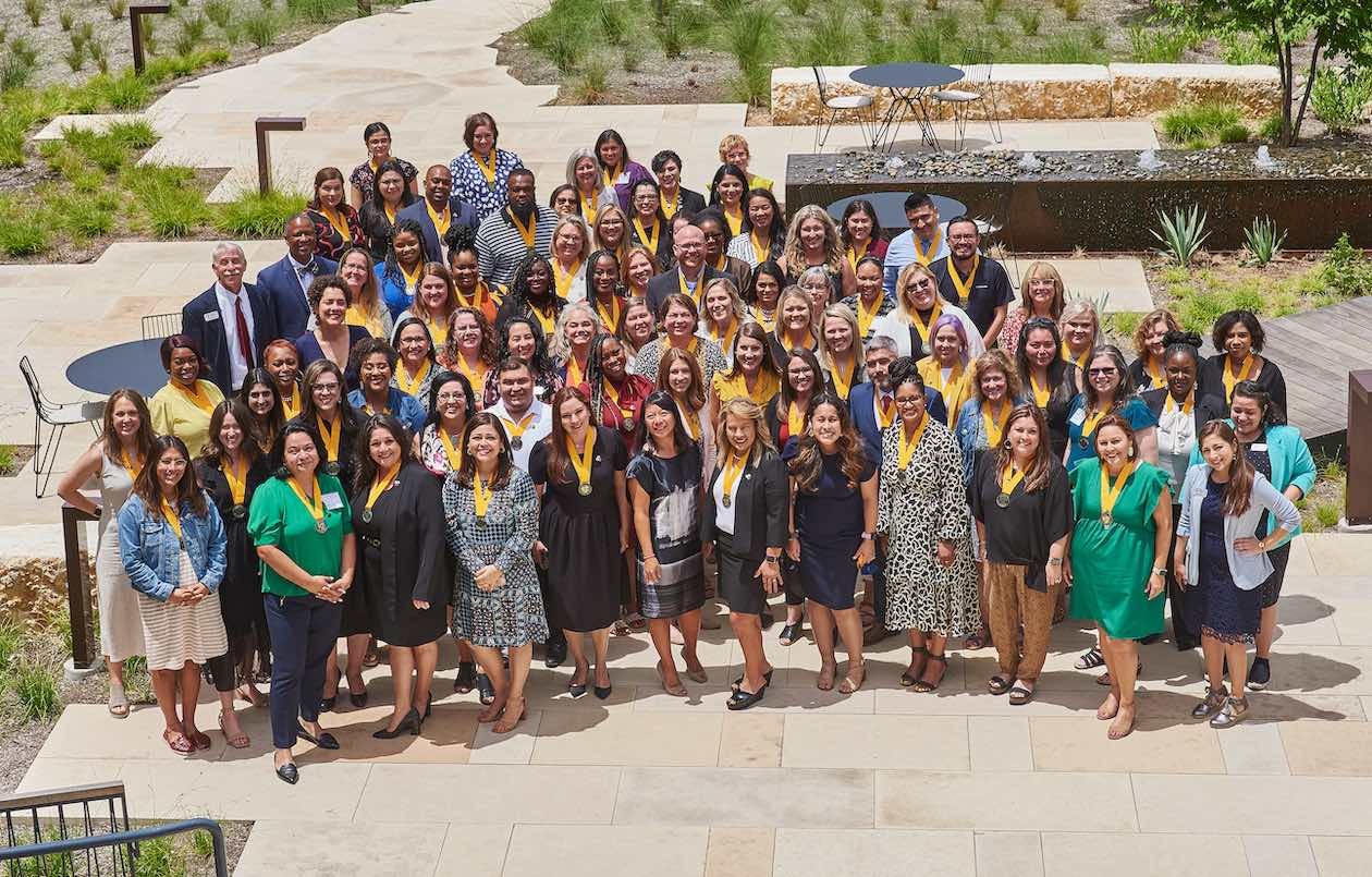 Campus principals, assistant principals, teachers and other campus leaders from Cohort 2.1 of The Holdsworth’s Center’s Campus Leadership Program pose for a group picture on the Holdsworth campus after completing the intense, 2-year leadership program.